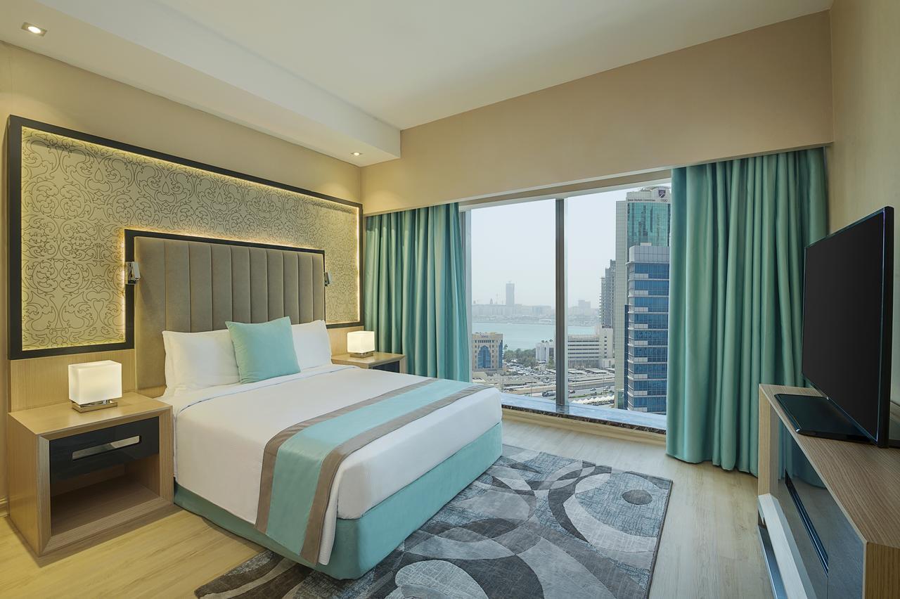 Готель Wyndham Doha West Bay Екстер'єр фото A bedroom at the hotel